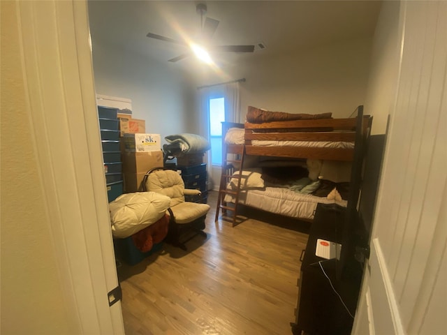 bedroom with ceiling fan and light wood-type flooring