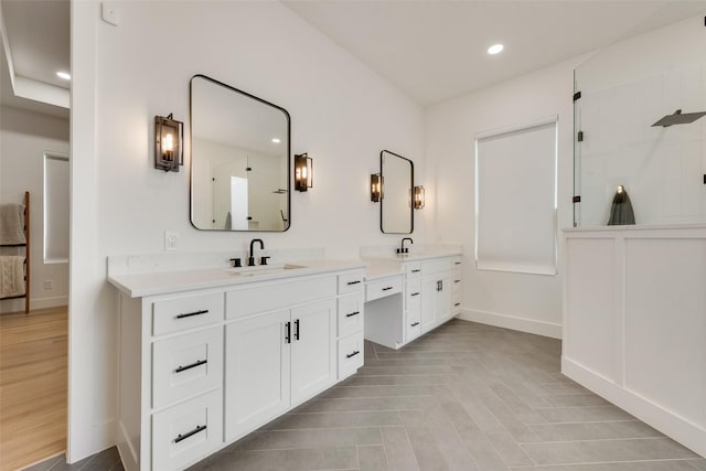 bathroom with vanity and walk in shower