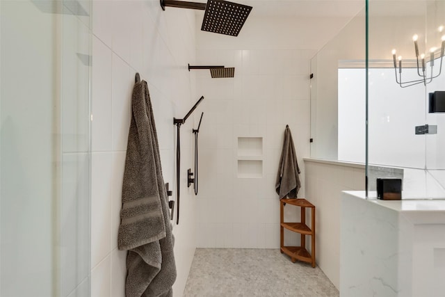 bathroom featuring tile walls and a shower