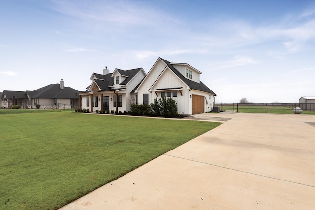 modern farmhouse style home featuring cooling unit and a front yard