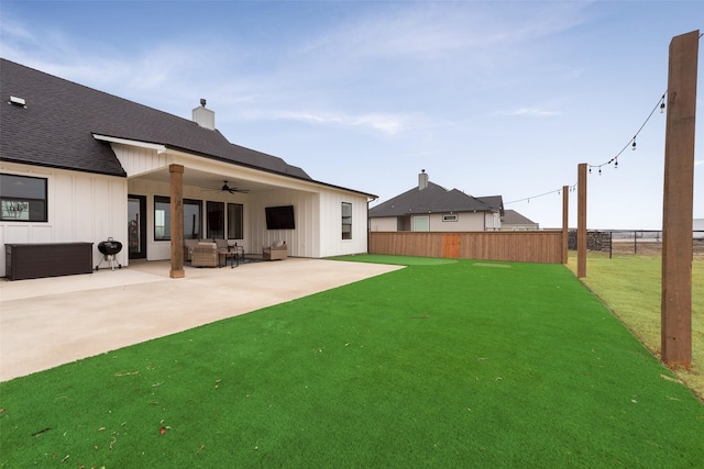 view of yard featuring a patio and ceiling fan