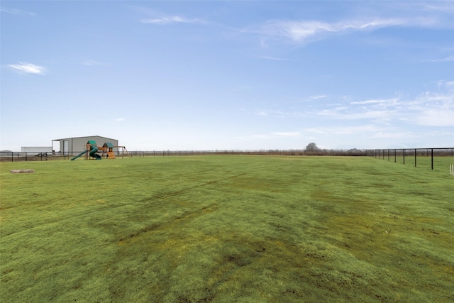 view of yard with a rural view and a playground