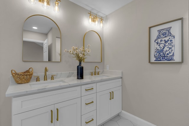 bathroom with tile patterned floors and vanity