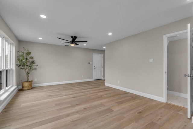 unfurnished room featuring ceiling fan and light hardwood / wood-style flooring