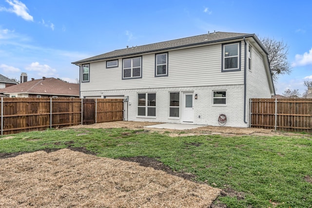 back of property featuring a yard and a patio area