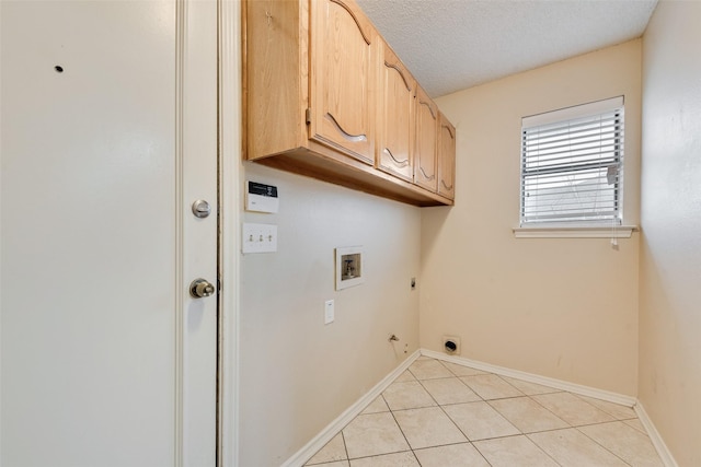 laundry area with gas dryer hookup, light tile patterned flooring, cabinets, hookup for a washing machine, and hookup for an electric dryer