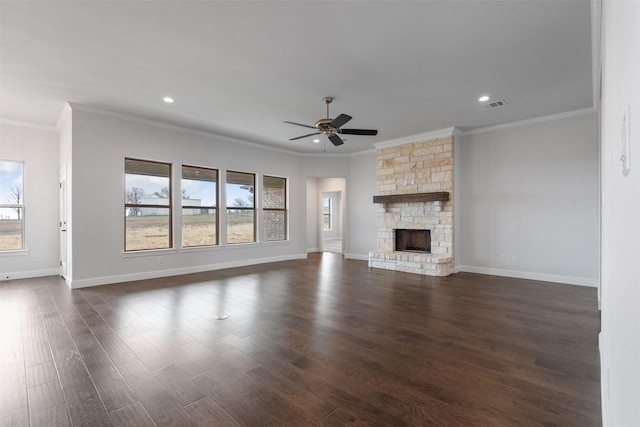 unfurnished living room featuring a stone fireplace, dark wood-type flooring, and ceiling fan