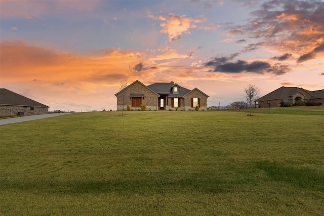 french country home with a lawn