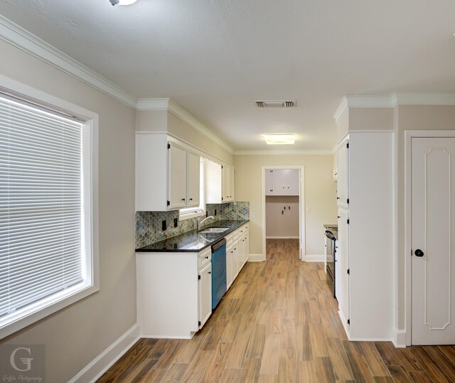 kitchen featuring white cabinetry, black electric range oven, sink, and dishwasher