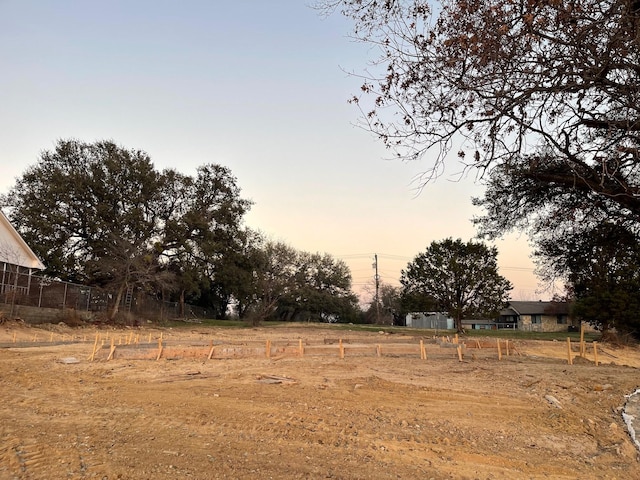 view of yard at dusk