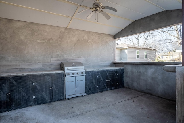 view of patio / terrace featuring grilling area, ceiling fan, and exterior kitchen