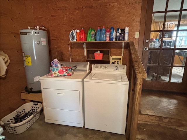 washroom featuring electric water heater and washer and clothes dryer