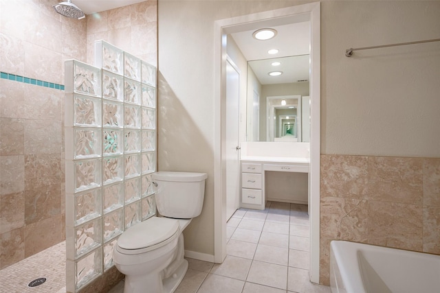 full bathroom featuring tile patterned flooring, vanity, separate shower and tub, and toilet