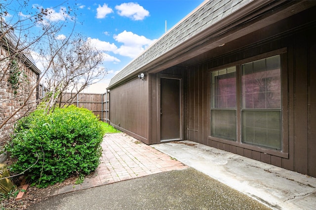 view of exterior entry featuring a patio