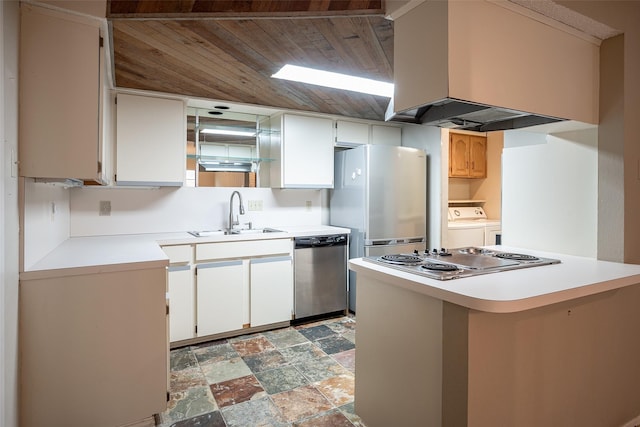 kitchen with extractor fan, sink, separate washer and dryer, kitchen peninsula, and stainless steel appliances