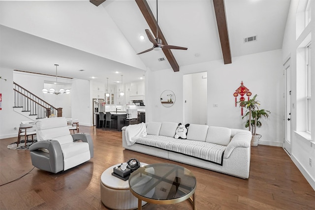 living room featuring ceiling fan with notable chandelier, beam ceiling, dark hardwood / wood-style flooring, and high vaulted ceiling