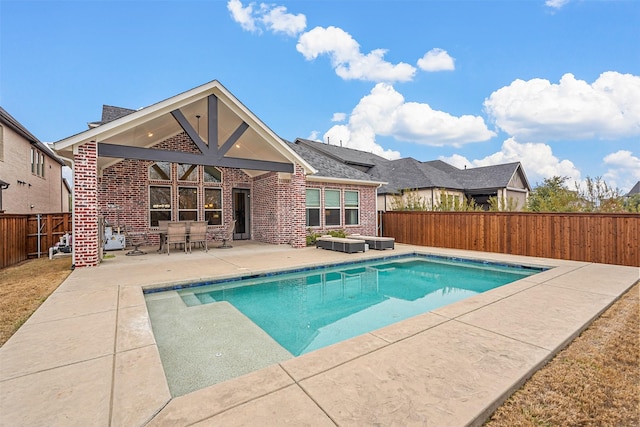 view of swimming pool featuring a patio