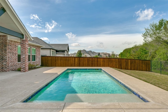 view of swimming pool with a lawn and a patio