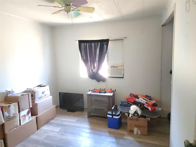 interior space featuring ceiling fan and light wood-type flooring