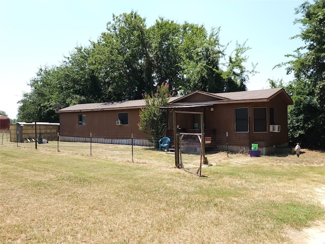 back of house featuring a yard