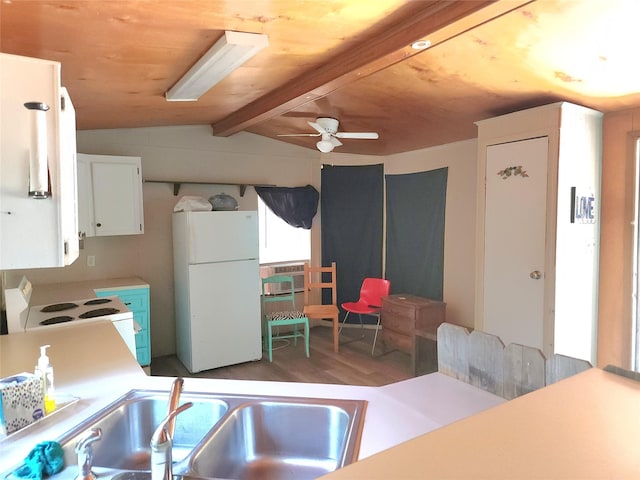 kitchen featuring white cabinetry, vaulted ceiling with beams, sink, white appliances, and light hardwood / wood-style flooring