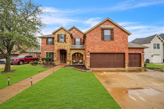 view of front of house with a garage and a front yard