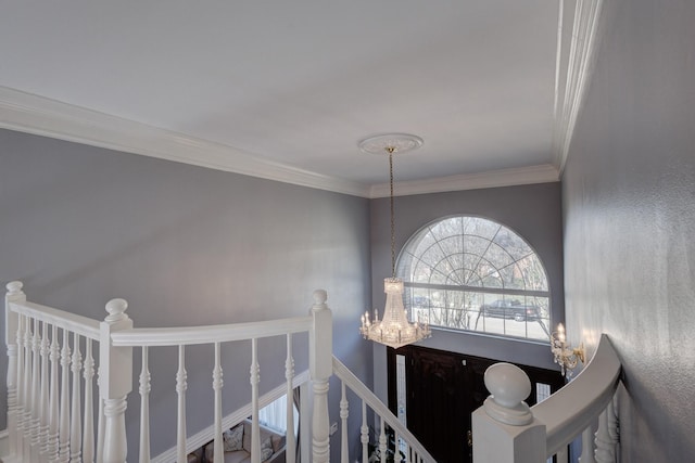 interior space featuring crown molding and a notable chandelier