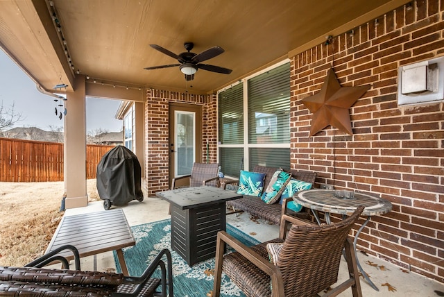 view of patio featuring a grill, outdoor lounge area, and ceiling fan