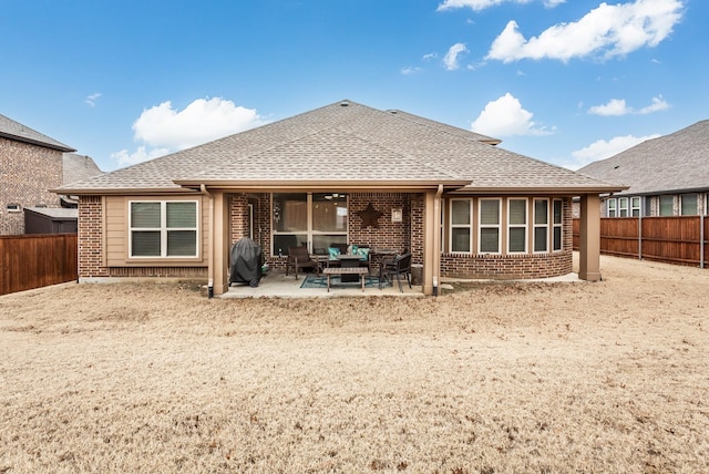 rear view of property with a patio area