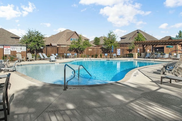 view of swimming pool with a pergola and a patio