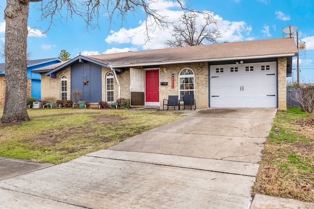 single story home with a garage and a front yard