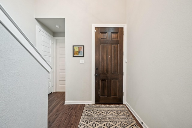 foyer with dark hardwood / wood-style floors