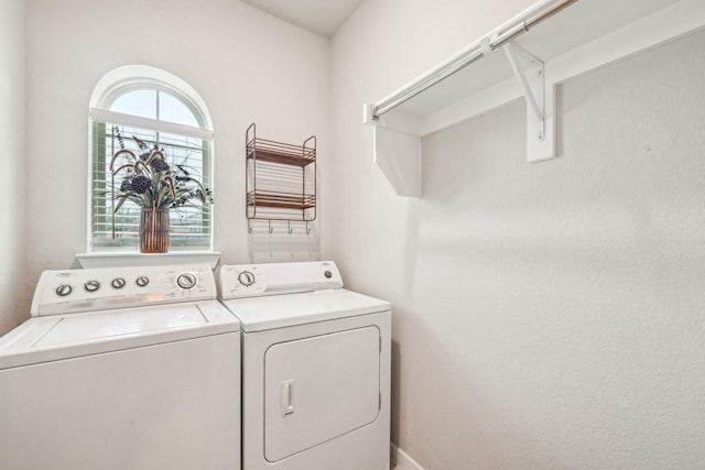 laundry room with washing machine and clothes dryer