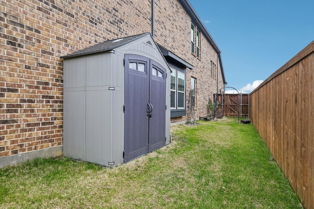 view of outdoor structure featuring a lawn