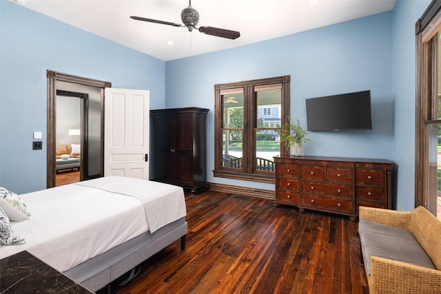 bedroom featuring dark wood-type flooring and ceiling fan