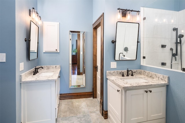 bathroom featuring vanity and a tile shower