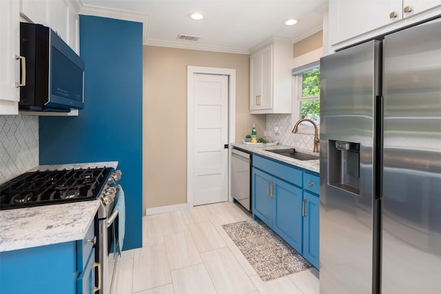 kitchen featuring sink, crown molding, stainless steel appliances, white cabinets, and blue cabinets