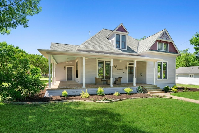 view of front facade featuring covered porch and a front lawn