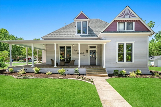 view of front of house with covered porch and a front yard