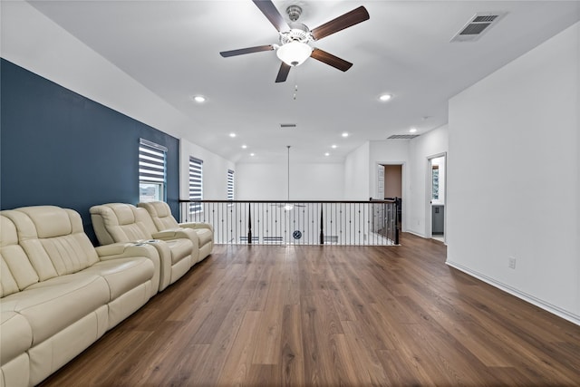 unfurnished living room with ceiling fan and hardwood / wood-style floors