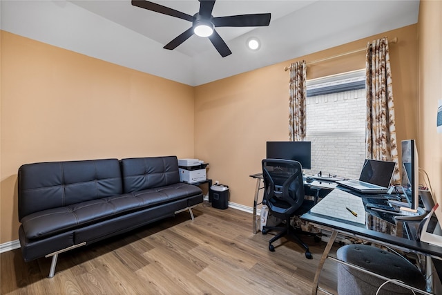 office with ceiling fan and light hardwood / wood-style flooring