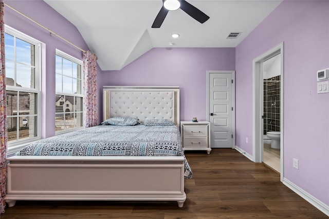 bedroom featuring dark wood-type flooring, ceiling fan, lofted ceiling, and connected bathroom