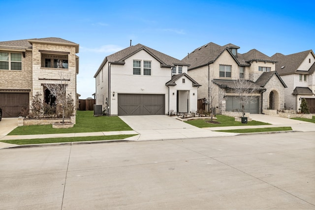 view of front of property featuring central AC, a garage, and a front yard