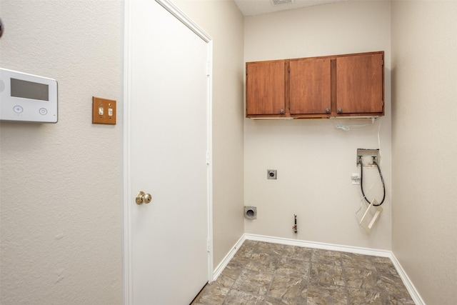 laundry room featuring cabinets, washer hookup, hookup for an electric dryer, and hookup for a gas dryer