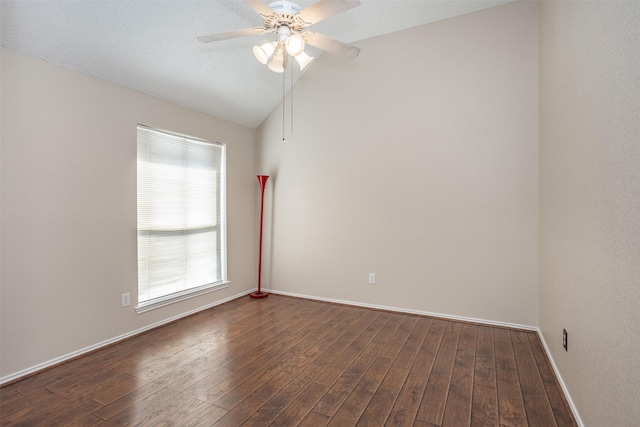 unfurnished room featuring lofted ceiling, dark hardwood / wood-style floors, and ceiling fan