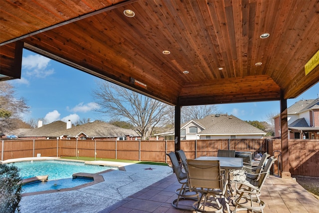 view of patio featuring a fenced in pool