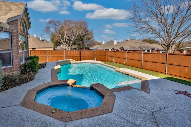 view of swimming pool featuring an in ground hot tub