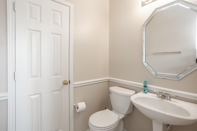 bathroom with sink and toilet