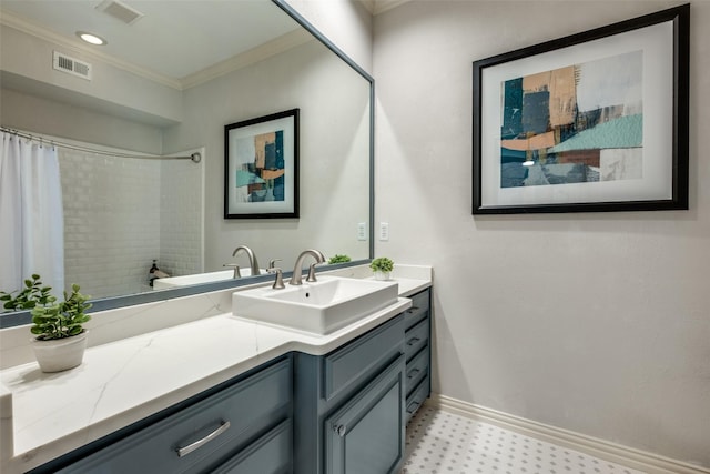 bathroom featuring crown molding and vanity