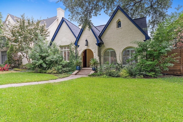 tudor house with a front lawn